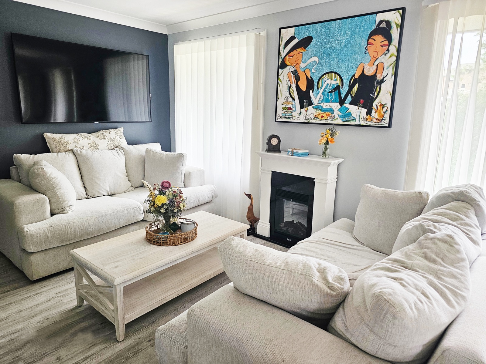 Breakfast at Tiffany's hanging above a fireplace in a collector's living room